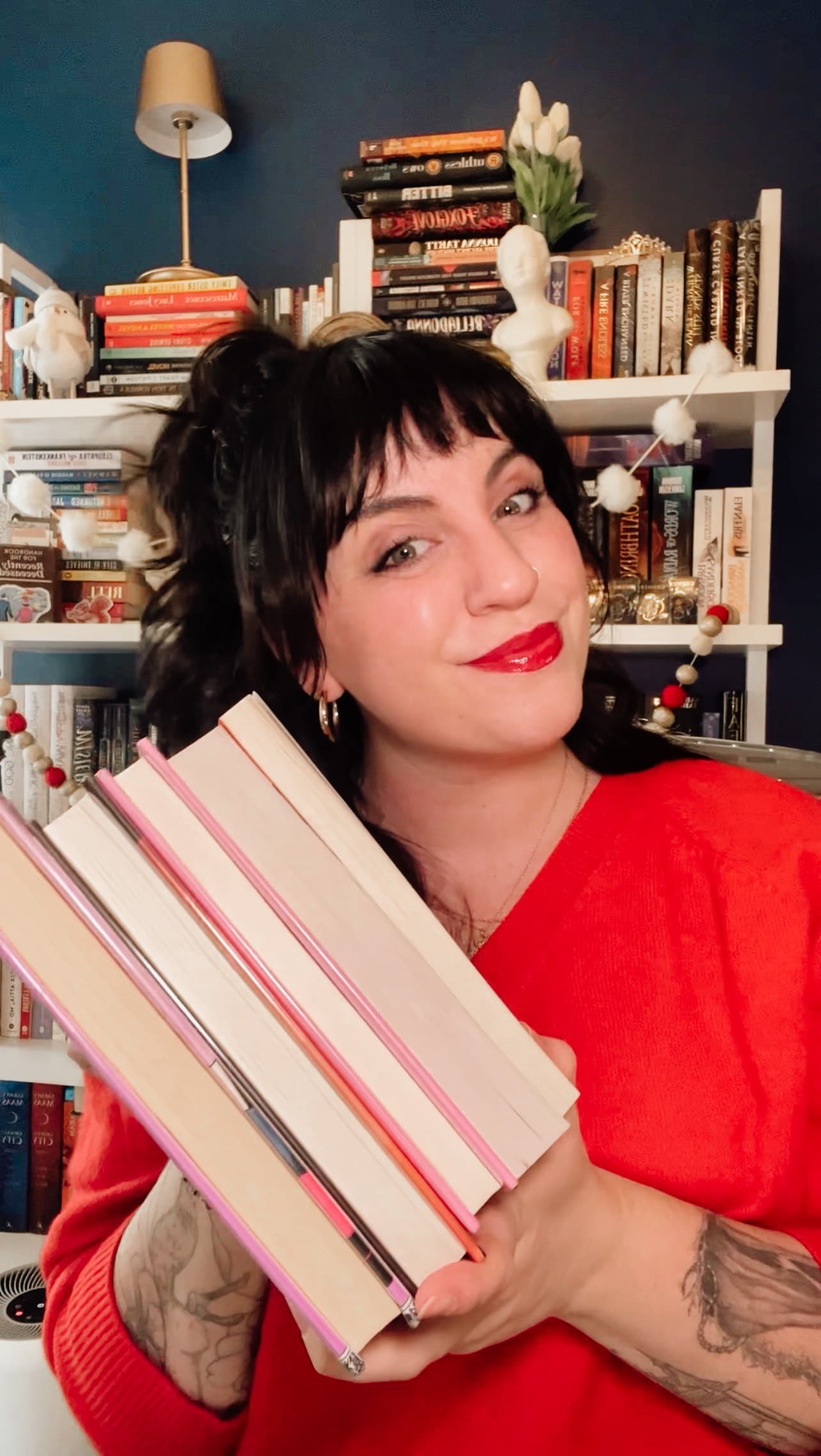 Alyssa McKnight at a bookshelf